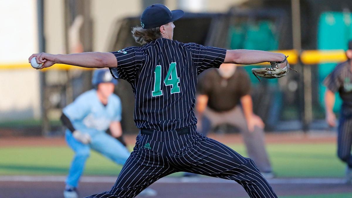 Carroll’s Griffin Herring (14) works the first inning during a UIL 6A Region I bi-district playoff baseball game at Carroll Senior High School in Southlake, Texas, Thursday, May 05, 2022. Herring threw a complete game with 112 pitches. Carroll defeated Bell to move on to the area round. (Special to the Star-Telegram Bob Booth)