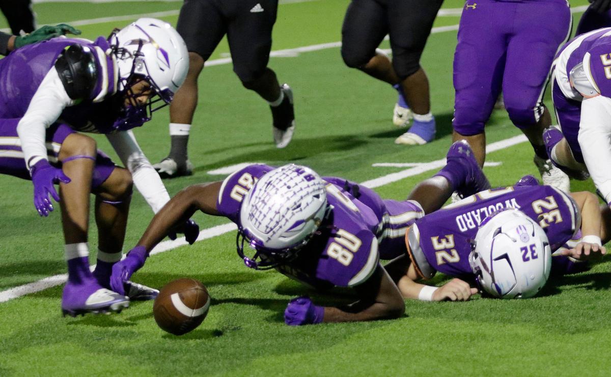 Alvarado’s Jorden Wright recovers a fumble deep in Eastern Hills territory during a UIL football playoff game at Crowley ISD Multi Purpose Stadium on Friday November 8, 2024.
