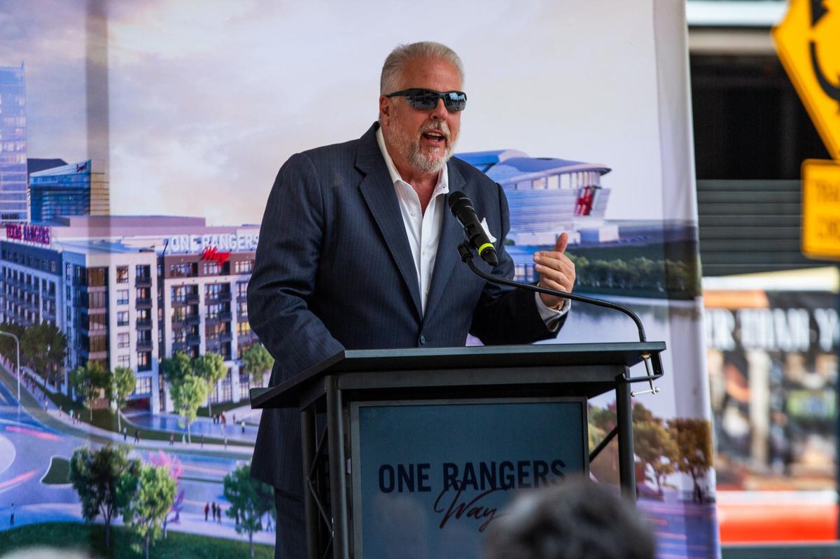 Arlington Mayor Jim Ross speaks to a crowd during the topping off ceremony for One Rangers Way on June 10 in Arlington’s entertainment district.
