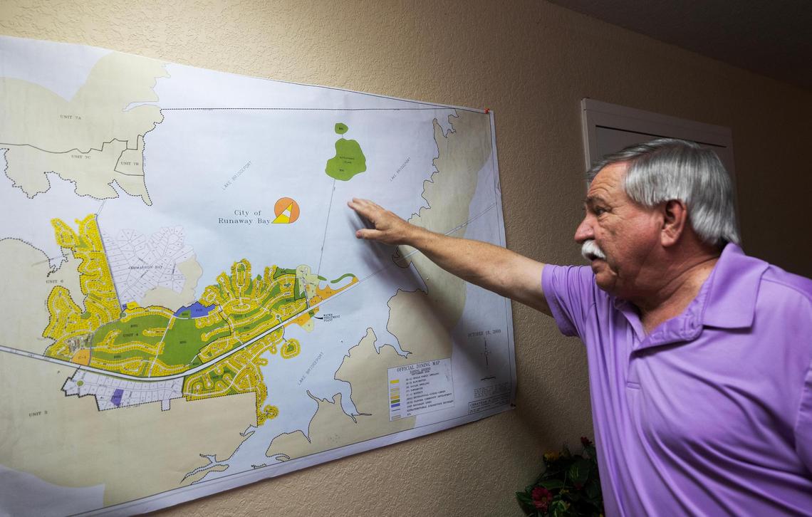 Mayor Herman White shows a map of Runaway Bay on Tuesday, March 25, 2025.