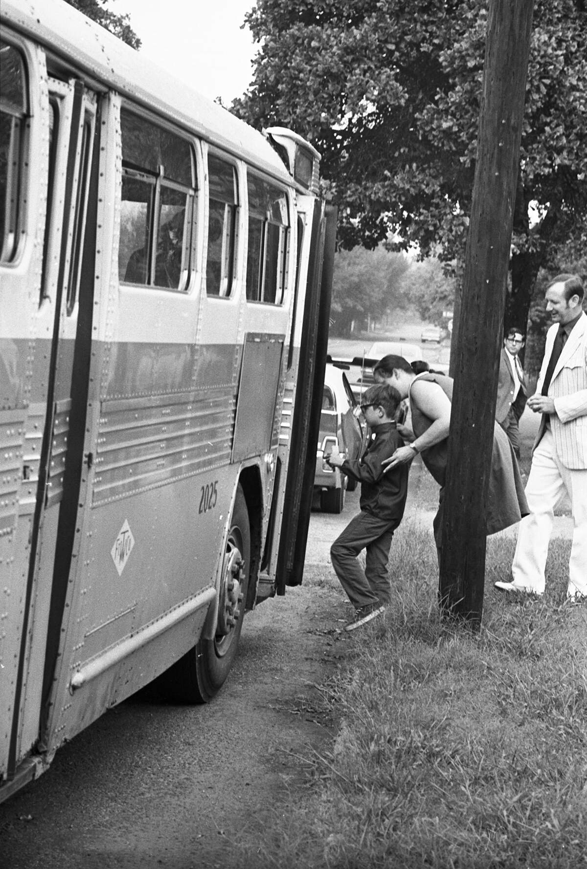Aug. 30, 1971: Oakhurst Elementary Principal Donald D. Couch, right, offered assistance along the Riverside cluster bus route as a mother assisted her son on board a bus. Couch drove along the route, stopping occasionally to speak with waiting children.