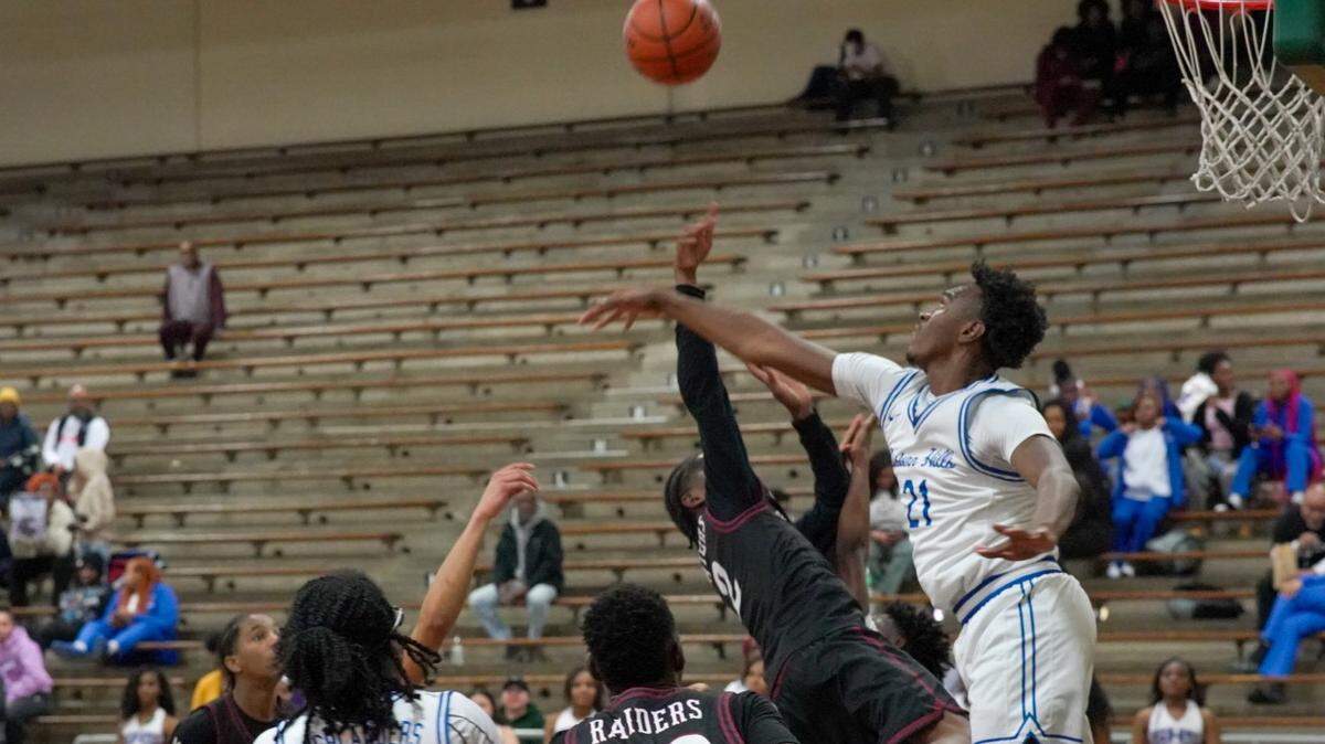 Fort Worth Eastern Hills’ Dorian Johnson (21) blocks the shot of Fort Worth Southwest’s Kordon Henderson (2) in a boys District 8-4A contest on Tuesday, January 14, 2025 at Billingsley Field House in Fort Worth, Texas.