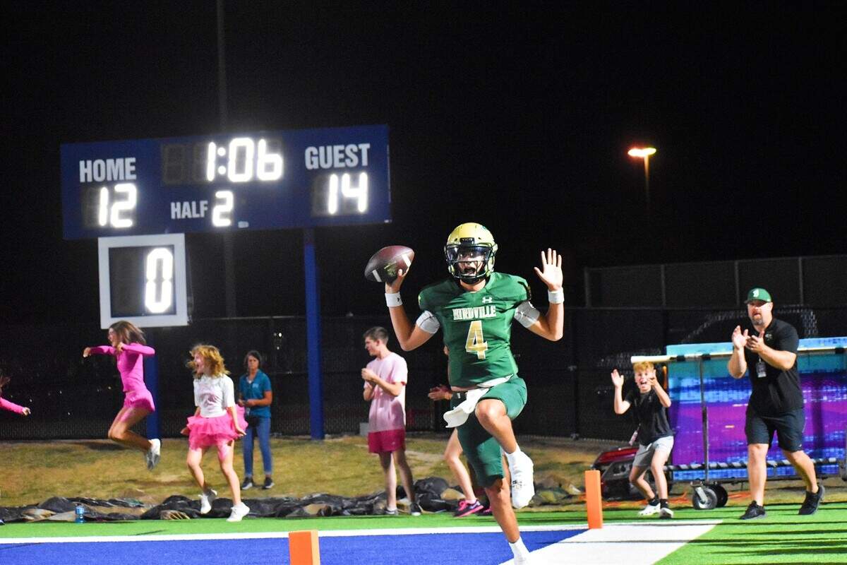 Birdville quarterback Noah Normand celebrates after catching a 15-yard touchdown catch on a reverse play in Friday’s game against Richland.