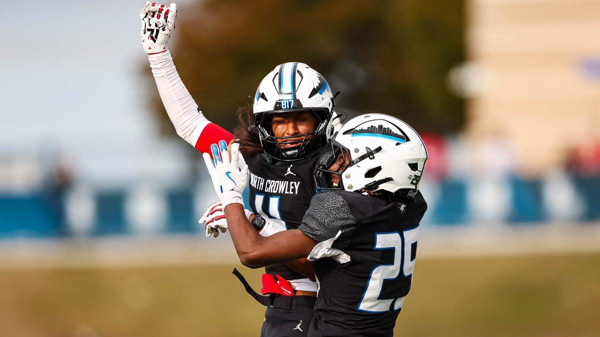 North Crowley returner Braylen Cunningham (25) leaps in the air with teammate Jerry Outhouse (4) after a play in a Class 6A Division I regional playoff against Coppell on Saturday, Nov. 29, 2025, at Midlothian ISD Stadium in Midlothian.