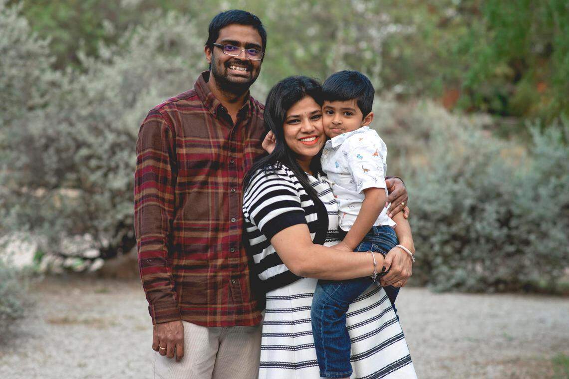 Vijay Durbhakula, left; Mahathi Koutha, center; and Pranay, right, struggled to keep warm Monday after their home in Hickory Creek lost power.