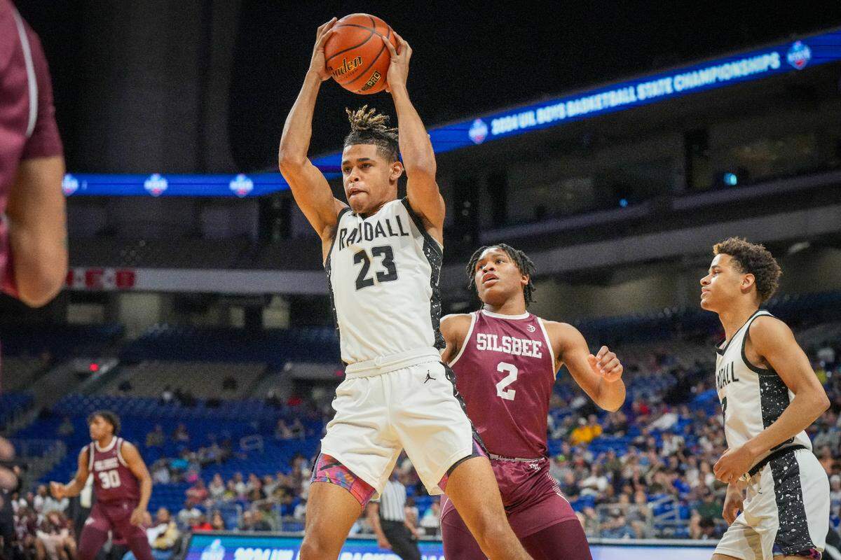 Amarillo Randall’s Tayren Combs (23) pulls down a rebound against Silsbee in a Class 4A state semifinal on Friday, March 8, 2024 at the Alamodome in San Antonio, Texas. Silsbee defeated Randall 75-68.