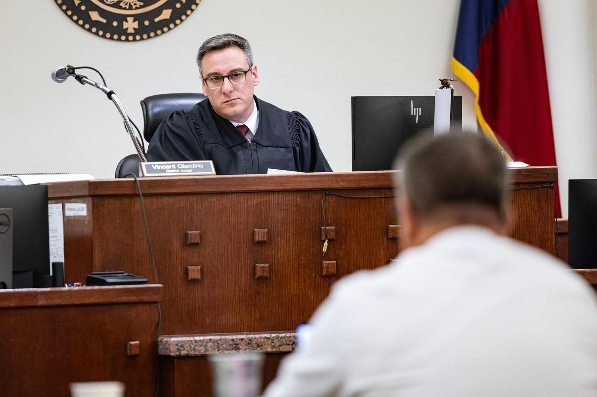 District Judge Vincent Giardino listens to the defense attorneys during the capital murder trial of Jacoby Roberts in the 369th District Court at the Tim Curry Criminal Justice Center in Fort Worth on Thursday, July 24. Roberts shot to death his cousin Jailon Freeman.