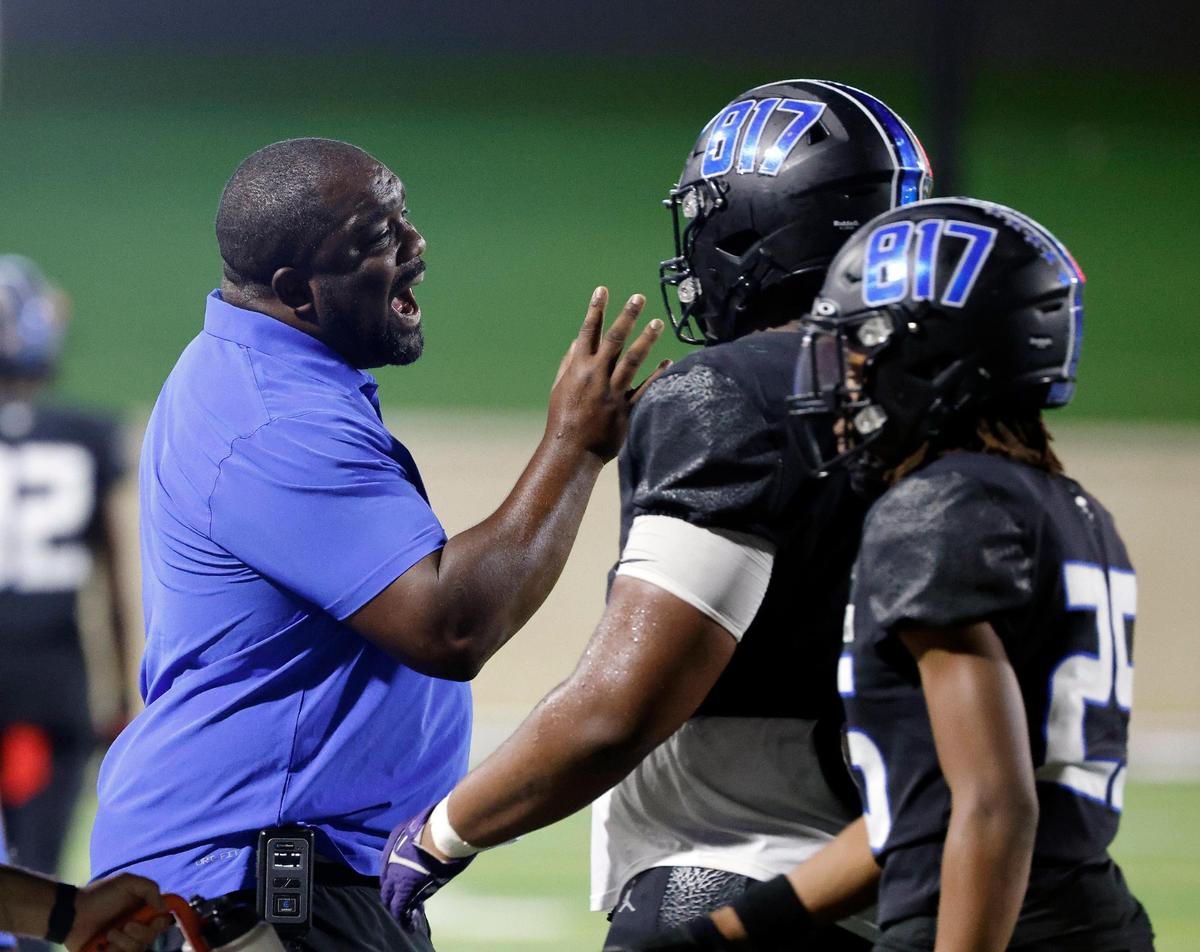 North Crowley head coach Ray Gates has a talk with a player in the first half of a UIL high school football game at Crowley ISD Multi-Purpose Stadium in Crowley, Texas, Friday, Sept. 22, 2023.