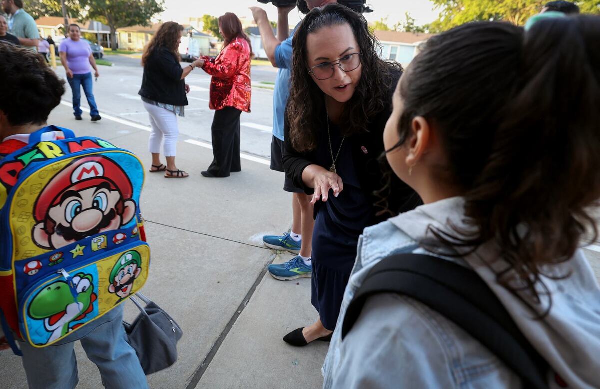 Fort Worth ISD Superintendent Angélica Ramsey greets students at M.H. Moore Elementary School for the first day of school on Tuesday.