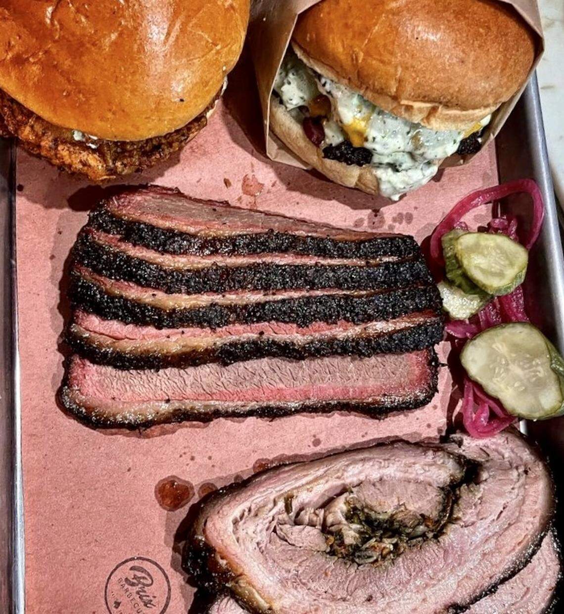 A hot chicken sandwich, burger, prime brisket and stuffed pork belly at Brix Barbecue in Fort Worth.
