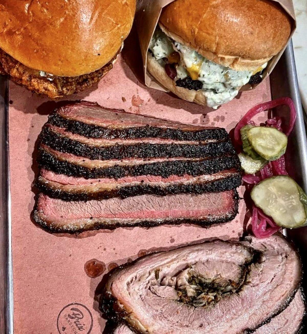 A hot chicken sandwich, burger, prime brisket and stuffed pork belly at Brix Barbecue in Fort Worth.