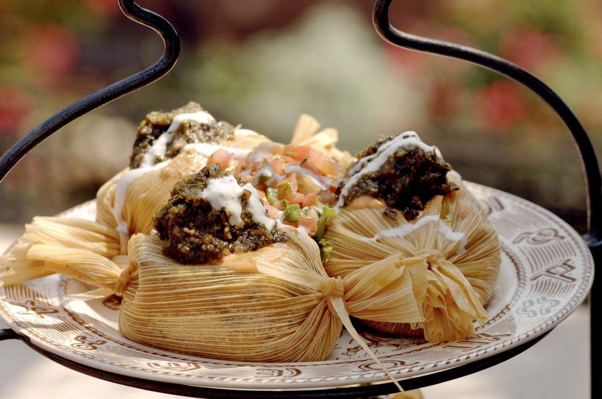 Reata’s tenderloin tamales with pecan mash are the restaurant’s signature dish.