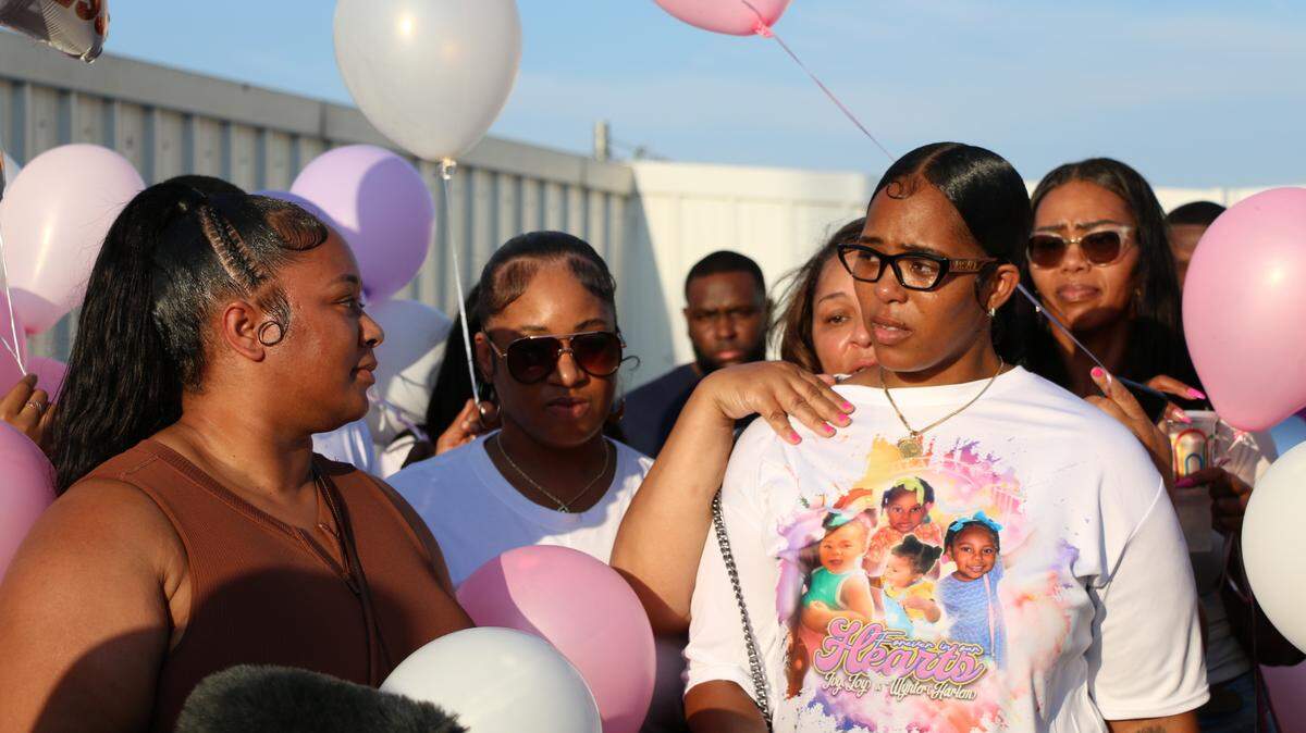 Sharde Mills (right) spoke at a balloon release for her two daughters Ivy Pierce, 4, and Wynter Thouston, 1. They died in a shooting outside of a car wash in Fort Worth on July 4, 2024.