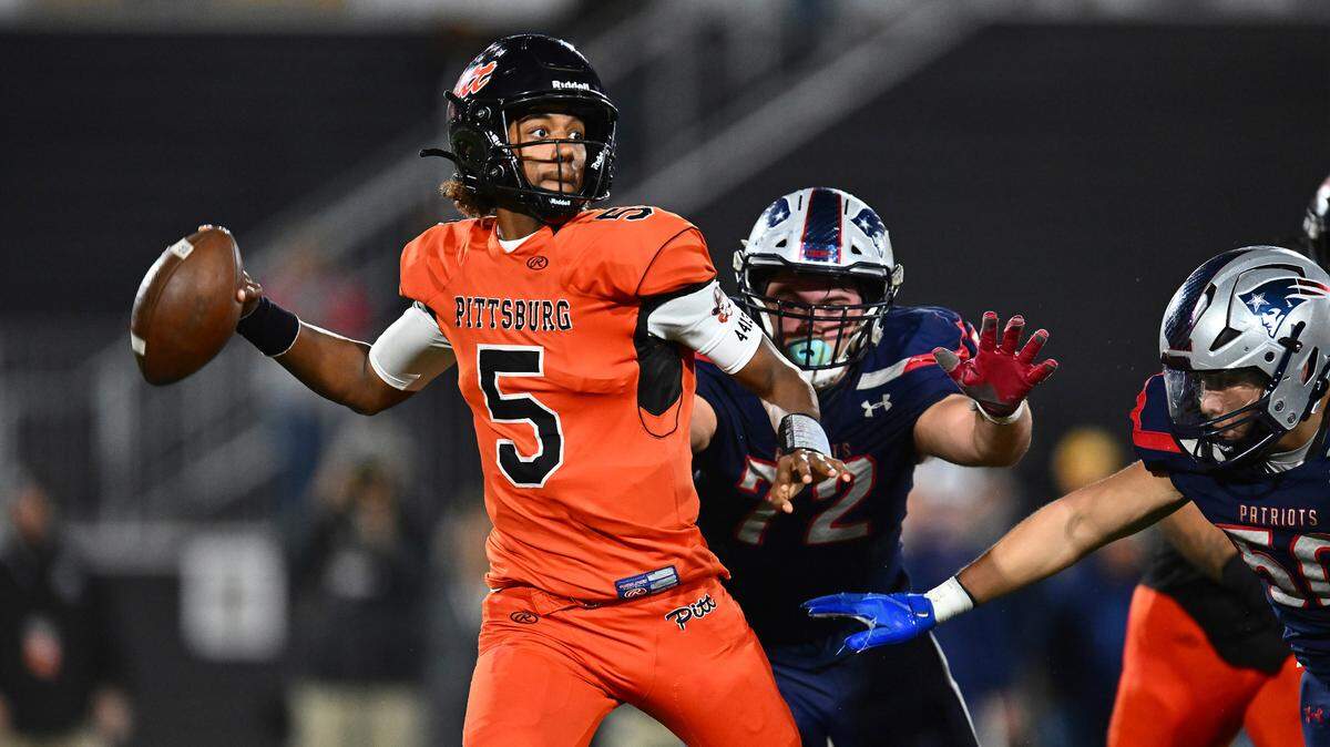 Pittsburg quarterback Jaden Rashada (5) is pressured by Liberty’s Grant Buckey (72) during the second quarter of the 2022 CIF State Football Championship Division 1-A game at Saddleback College in Mission Viejo, Calif., on Dec. 10, 2022. Florida has granted Rashada a release from his national letter of intent. It comes three days after he requested to be let go because the Gator Collective failed to honor a four-year name, image and likeness deal worth more than $13 million. (Jose Carlos Fajardo/Bay Area News Group via AP)