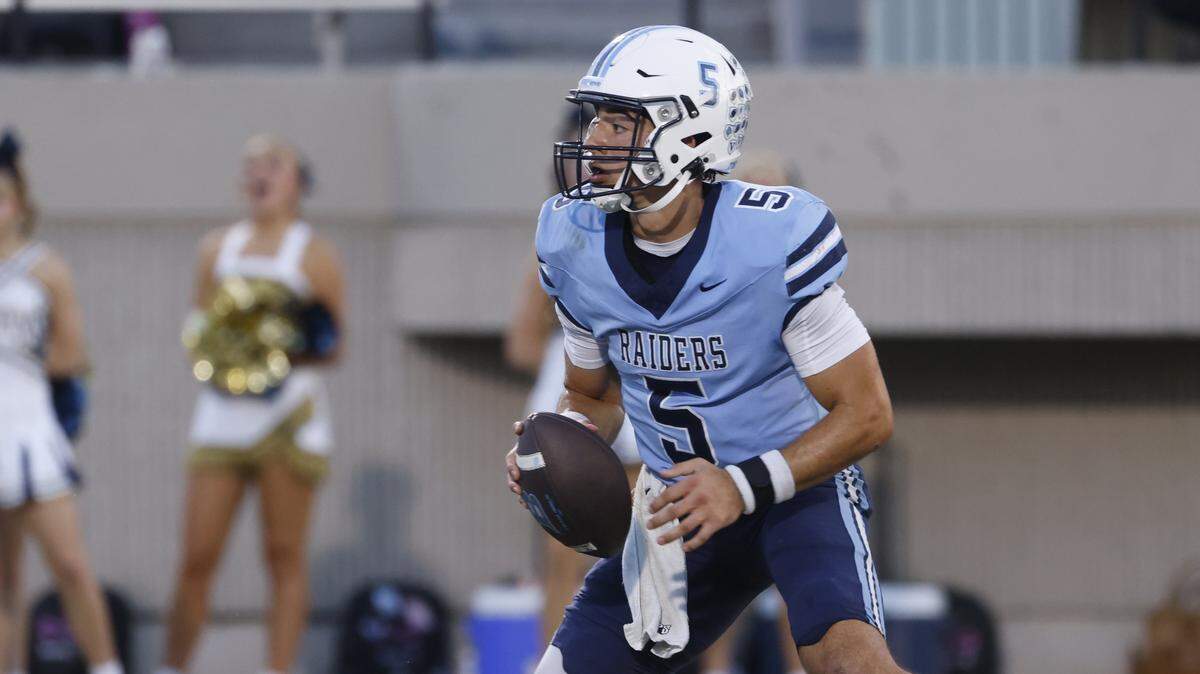 L.D. Bell quarterback Braylon Harris (5) scrambles out of the backfield during the first half of a UIL football game between Keller and L.D. Bell at Pennington Field in Bedford, Texas, Friday, Sept. 19, 2025.
