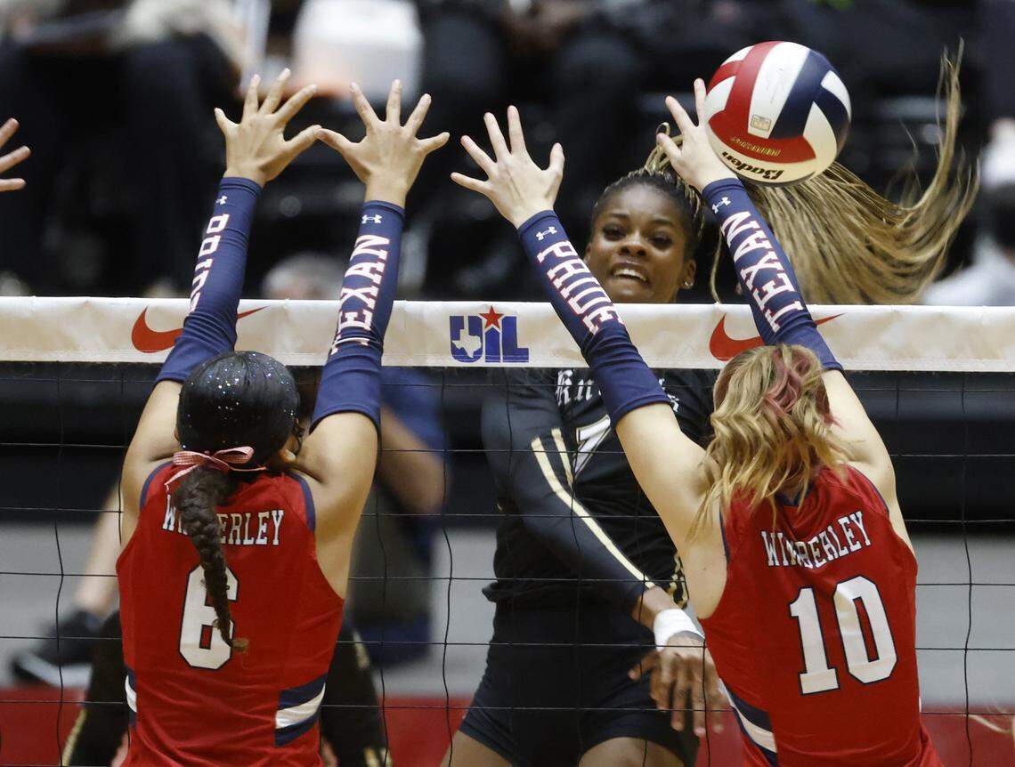 Fort Worth Eagle Mountain middle blocker Keoni Williams (1) gets a shot past Wimberley right side Ellen Watson (10) during the first set of the UIL Class 4A Division II state volleyball championship game Friday Nov. 21, 2025 at Curtis Culwell Center in Garland, Texas.