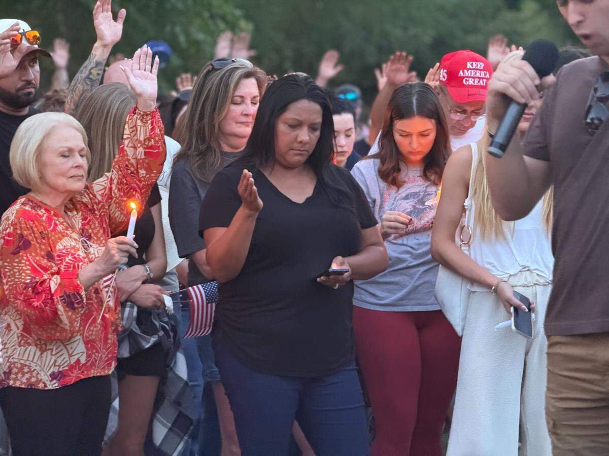 About 1,000 North Texans prayed at a vigil for Charlie Kirk on Sunday night, Sept. 14, at Trinity Park in Fort Worth.