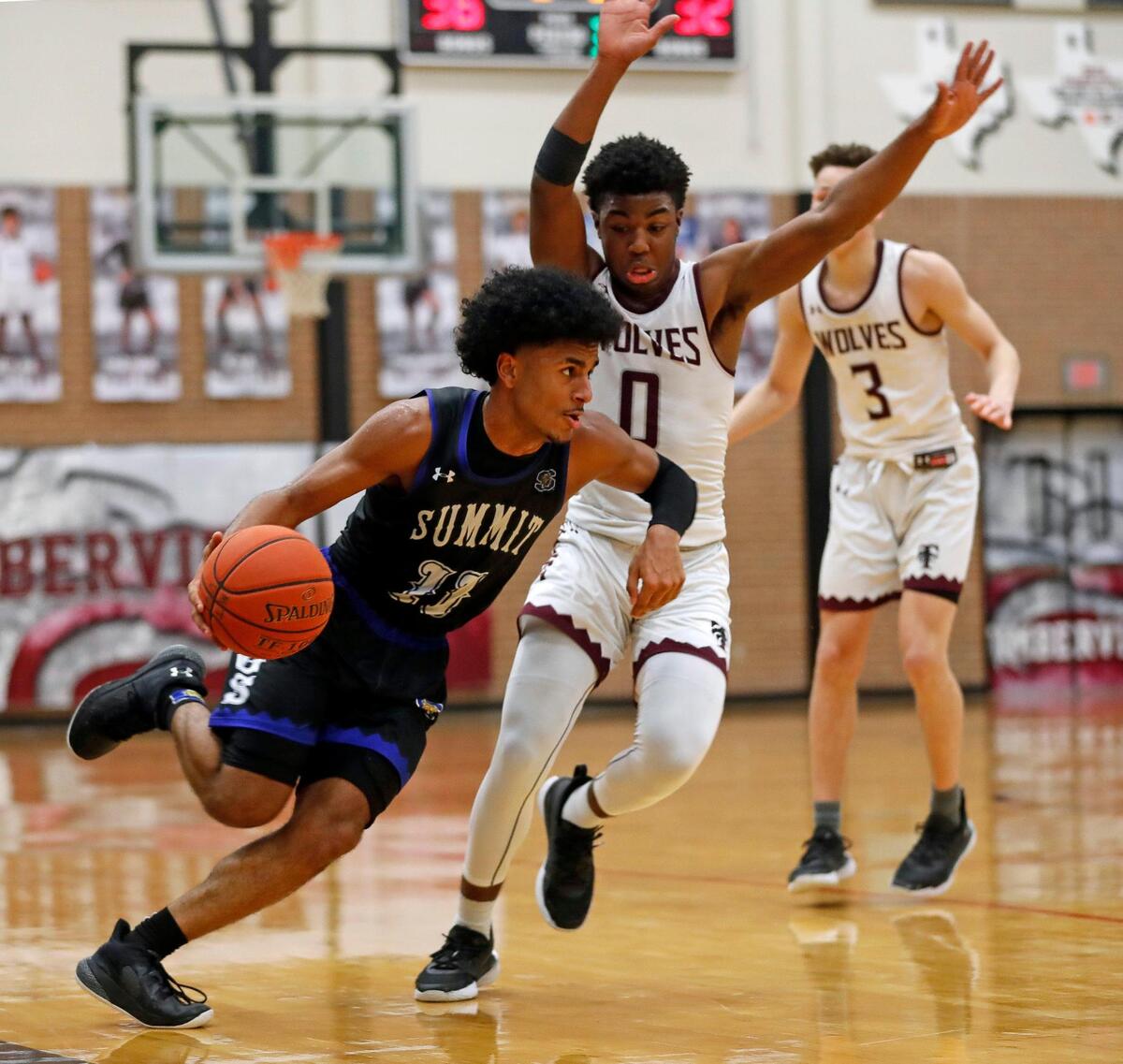 Summit guard Channon Hall (11) attempts to get around the defense of Timberview guard Braylon Crosby (0) during a high school basketball game at Timberview High School in Arlington, Texas, Tuesday, Jan. 05, 2021. Summit Jaguars defeated the Timberview Wolves 64-62. (Special to the Star-Telegram Bob Booth)