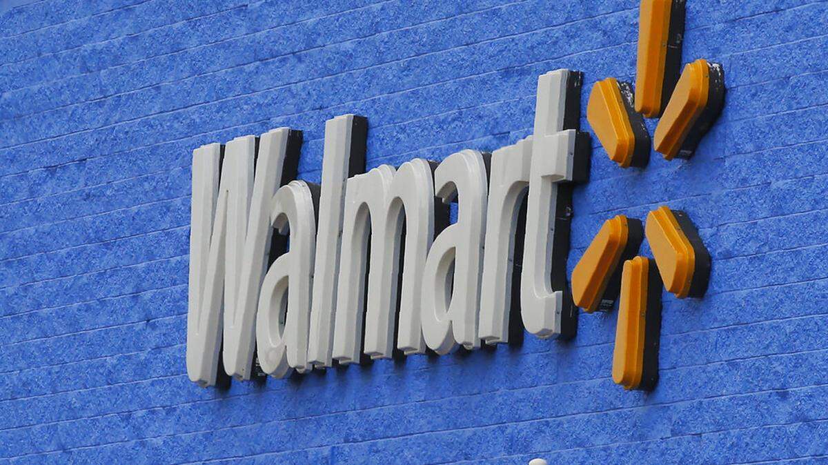 Georgia authorities are searching for a man accused of posing as a Walmart employee and stealing thousands of dollars worth of iPhones. (AP Photo/Sue Ogrocki)