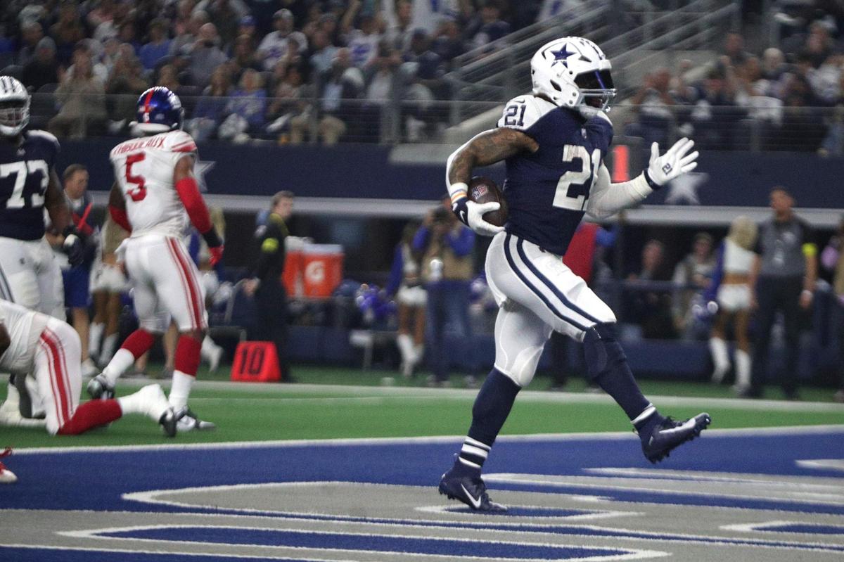 Dallas Cowboys running back Ezekiel Elliott scores a touchdown in the second half of their game against the Giants at the AT&T Stadium in Arlington on Thursday, Nov. 24, 2022.