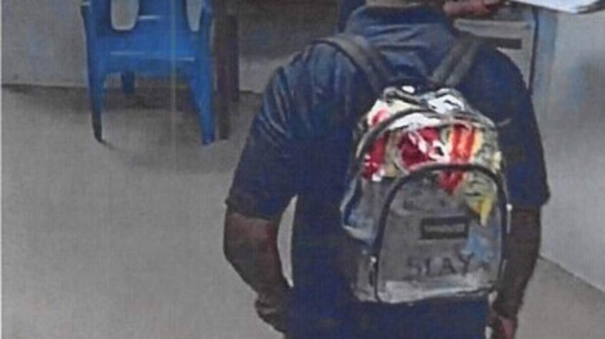 This photo, from a Tarrant County Juvenile Services’ internal investigation report, shows former juvenile detenttion officer Dwayne Slay bringing in a large bag of Flamin’ Hot Funyuns.