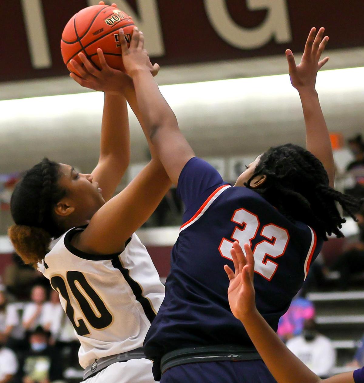 Mansfield guard Kendyl Howell (20) tries to get a shot off against Sachse guard Micah Cooper (32) during the first half of the 6A Region II Girls Basketball Area -Round 2 played February 23, 2021 at Lewisville High School. (Steve Nurenberg Special to the Star-Telegram)