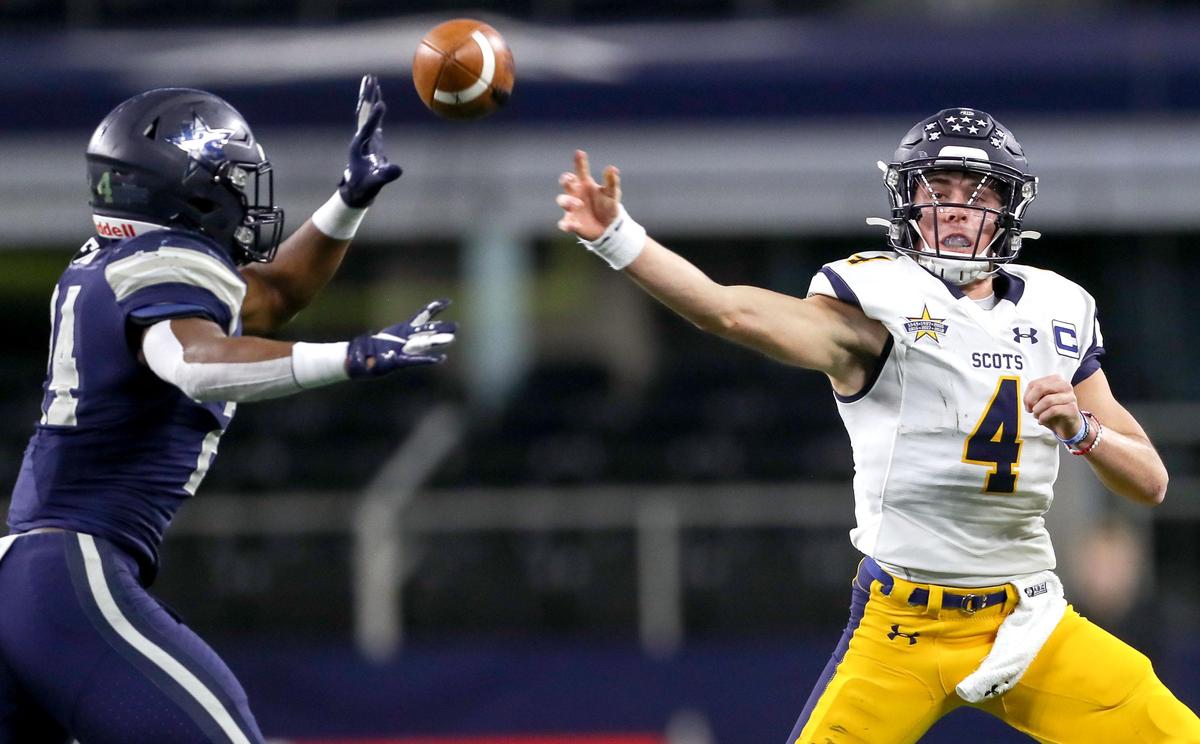 Highland Park quarterback Chandler Morris tries to get off a pass against Frisco Lone Star linebacker Jaylan Ford (24) during the first half of their 5A Division I Regional Round High School Football playoff game at AT&T Stadium in Arlington, Tx Friday November 29, 2019.
