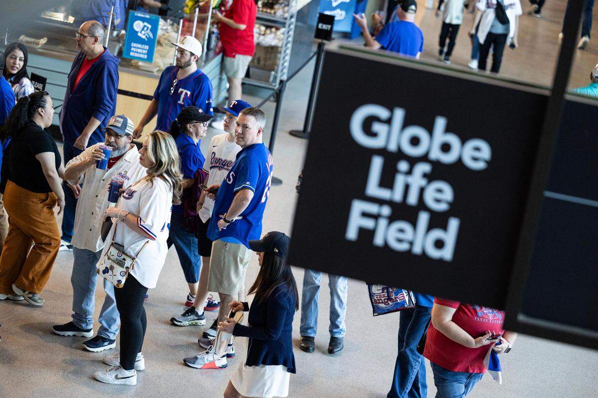 Texas Rangers fans enter the stadium for the 2024 season opener between the Rangers and the Chicago Cubs at Globe Life Field in Arlington on Thursday, March 28, 2024.