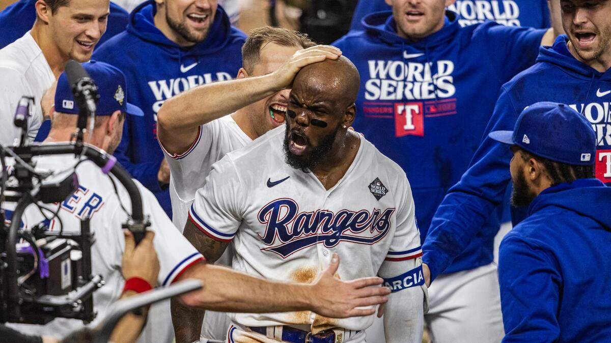 Texas Rangers right fielder Adolis Garcia celebrates with teammates after hitting a walk-off home run in the 11th inning during Game 1 of the World Series against the Arizona Diamondbacks on Friday, October 27, 2023, at Globe Life Field in Arlington. The Rangers went on to win their first-ever World Series.