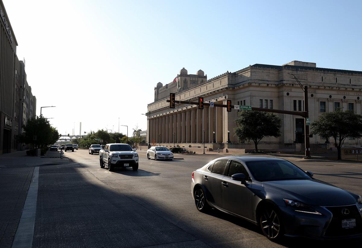 Vehicles drive along West Lancaster Avenue at Jennings Avenue in Aug. 2024. Pedestrians remain rare sightings on the street, despite the I-30 overhead’s removal more than two decades ago.