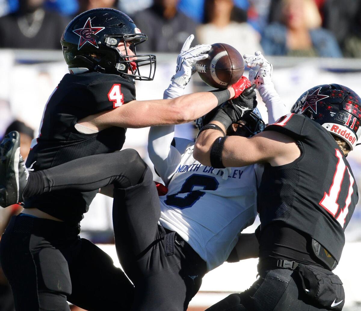 North Crowley wide receiver Quentin Gibson (6) comes up with the catch between Coppell safety Scott Fishpaw (4) and linebacker Weston Polk (11) during the UIL District 6A D1 Regional football game at Vernon Newsom Stadium in Mansfield, Texas, Saturday, Nov. 30, 2024.