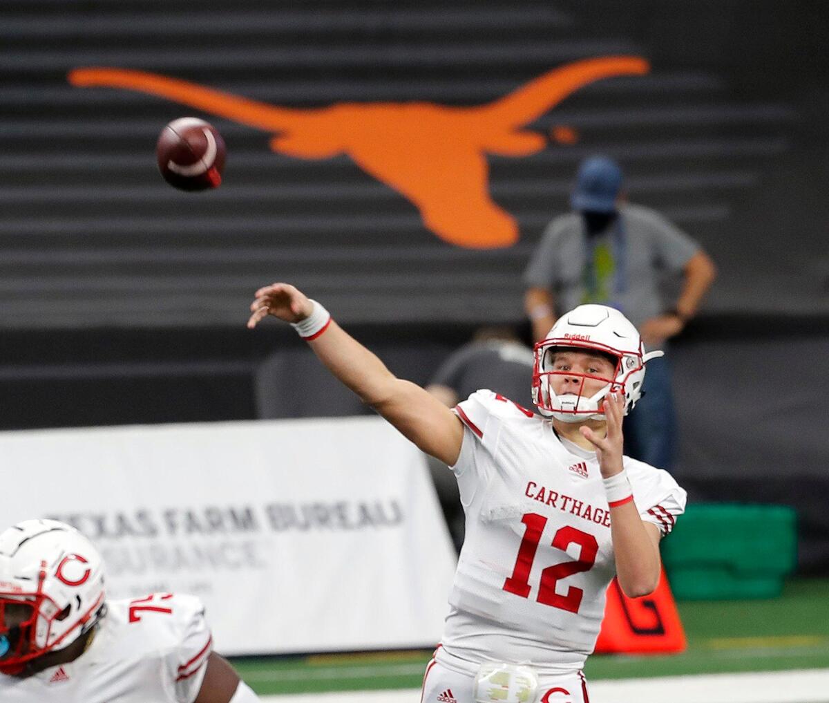 Carthage’s Kai Horton (12) tosses a completion downfield during a Conference 4A Division 2 State Championship football game at AT&T Stadium in Arlington, Texas, Friday, Dec. 18, 2020. Carthage led 42-14 at the half. (Special to the Star-Telegram Bob Booth)