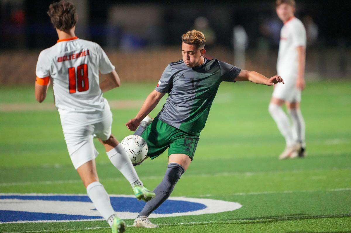 Fort Worth Trimble Tech midfielder Daniel Jimenez goes for a kick against Frisco Wakeland during the Class 5A state semifinals at Birkelbach Field in Georgetown on April 14, 2022 (Ken Murphy/MaxPreps)