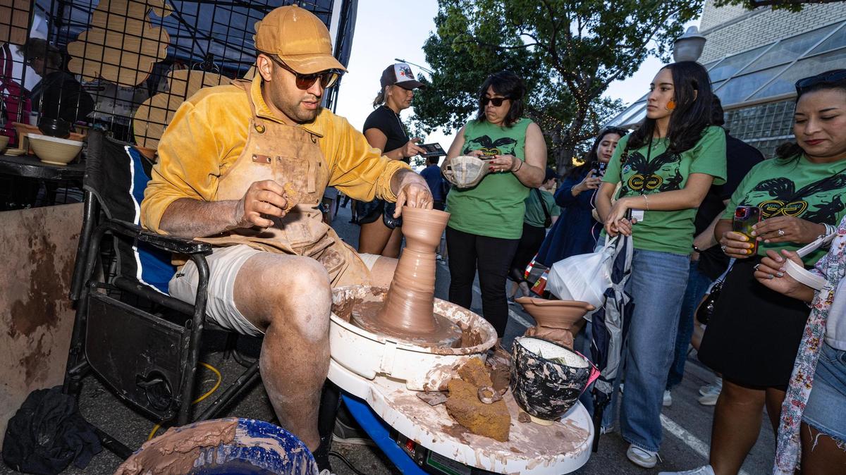 Stephen Salter molds pottery with clay for the crowd around him during the Arts Goggle event on Magnolia Avenue in Fort Worth on Saturday, Oct. 19, 2024.