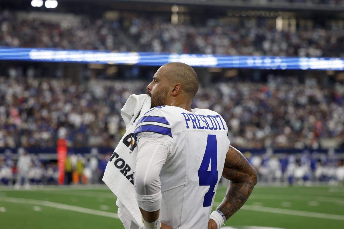 Dallas Cowboys quarterback Dak Prescott watches from the sidelines as the New York Giants work on a drive to take the lead in the final minutes of the fourth quarter on Sunday, Sept. 14, 2025, at AT&T Stadium in Arlington.