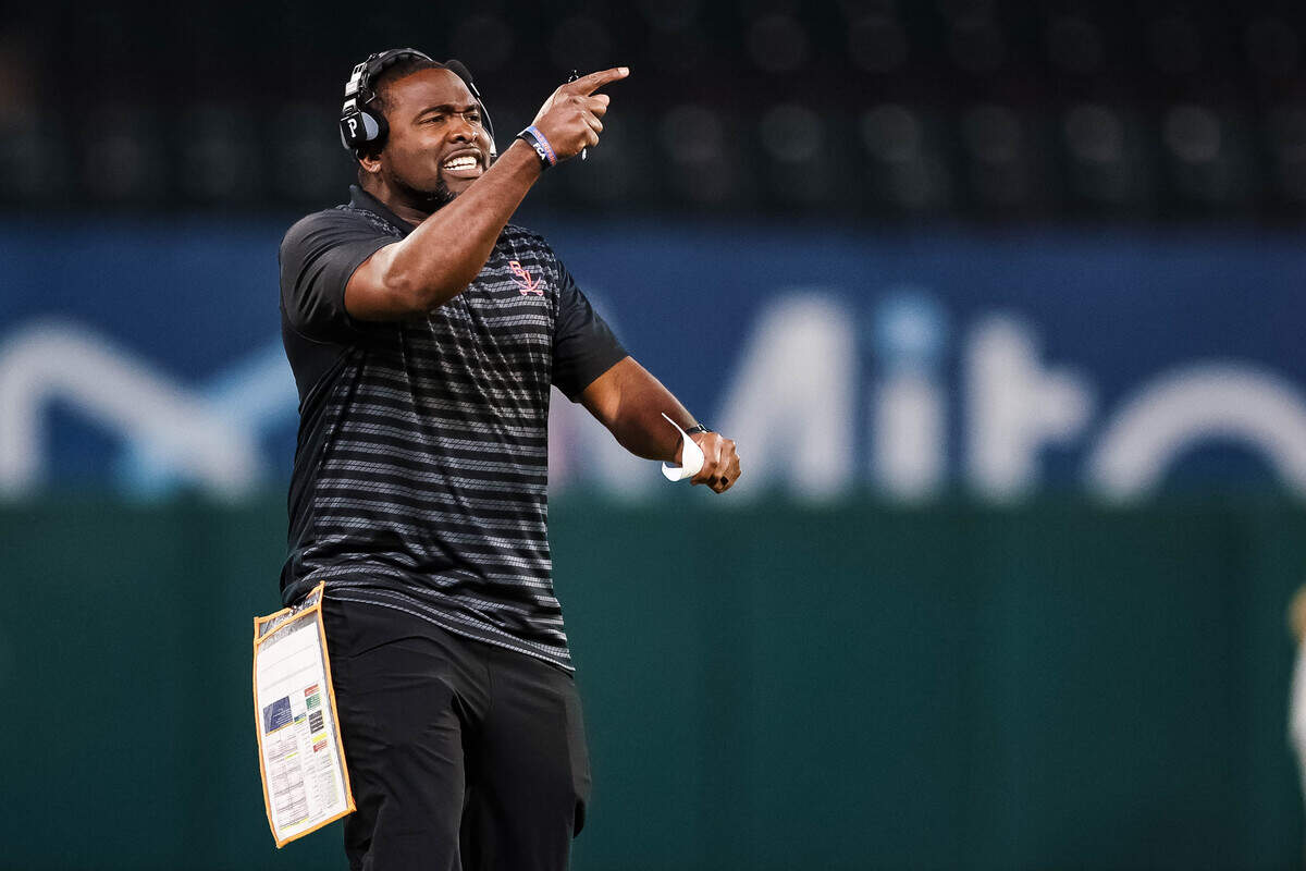 Arlington Bowie head coach Joseph Sam yells and points to his defense in a district match up against Arlington Lamar at Choctaw Stadium in Arlington, Texas on October 30, 2025.