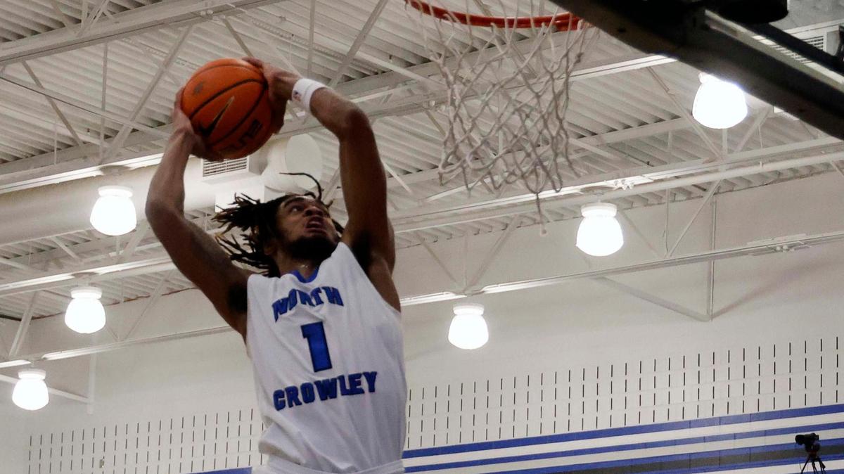 North Crowley wing KD Davis (1) flies in for the bucket during the first period of a UIL basketball game at North Crowley High School in Fort Worth, Texas, Tuesday, Feb. 13, 2024.