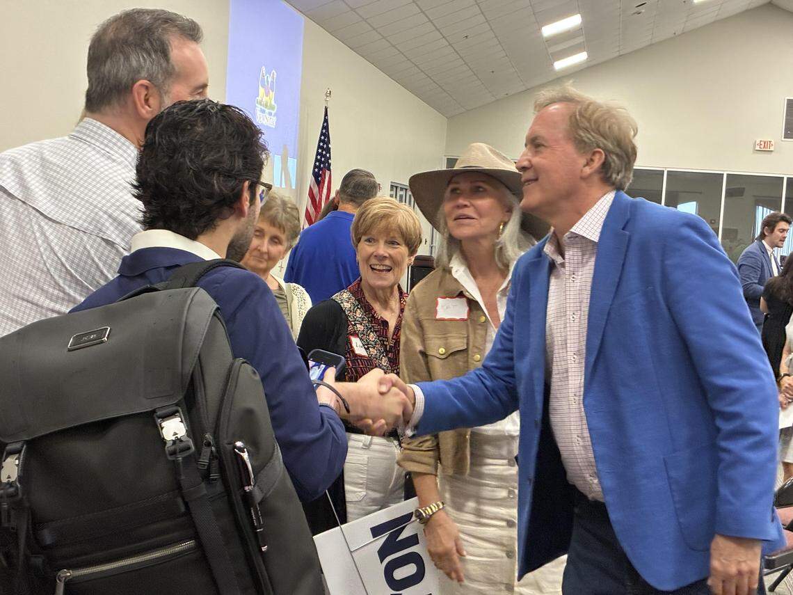 Texas Attorney General Ken Paxton meets with attendees at an April 23 Grapevine Republican Club meeting. He’s in a May 26 Republican primary runoff for U.S. Senate against Sen. John Cornyn.