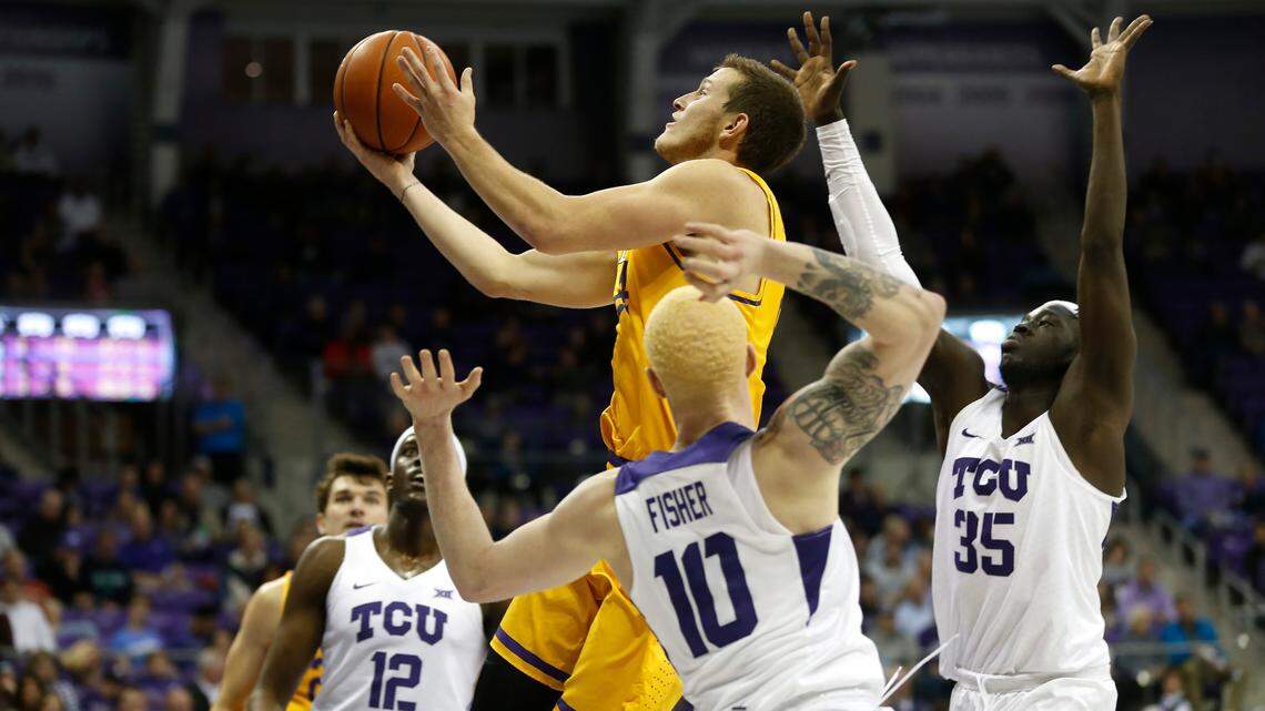 Lipscomb guard Garrison Mathews (24) drives inside past TCU defenders Jaylen Fisher (10), Kouat Noi (12) and Yuat Alok (35) during the first half Tuesday in Fort Worth.