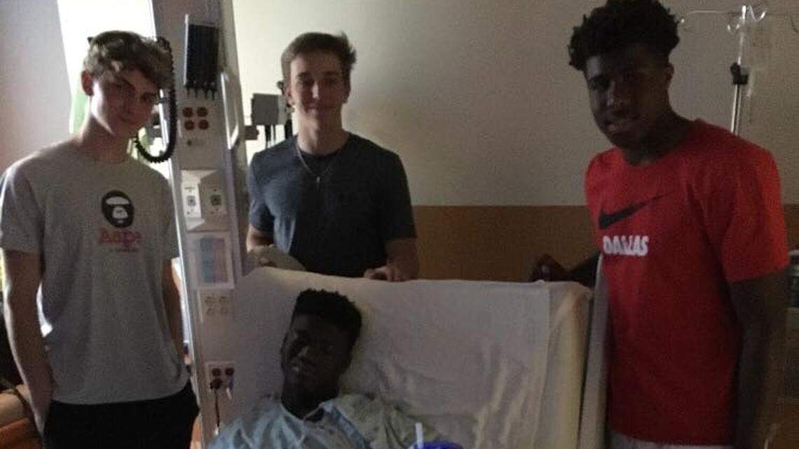 Arlington Lamar's Brett Green is recovering at JPS Trauma Center. He was visited by some players from Southlake Carroll including QB Will Bowers (middle) and DB R.J. Mickens (right).
