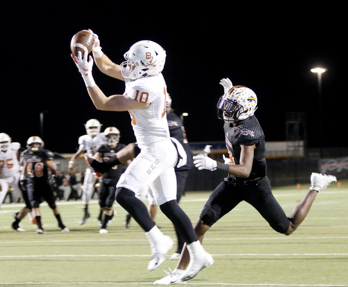 Bowie defensive back Ty DeArman (10) grabs a touchdown pass in front of Haltom wide receiver Julian Johnson (8) during the first half of a high school Bi-district football playoff game at Birdville FAAC in North Richland Hills, Texas, Thursday, Nov. 16, 2018. Bowie led 28-25 at the half. (Star-Telegram Bob Booth)