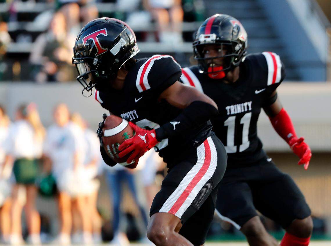 Trinity defensive back Devin Ugbaja (23) intercepts a Prosper pass in the first half of a high school football game against Prosper. Prosper won 17-13.