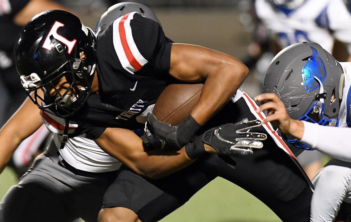 Trinity’s Ollie Gordon, breaks through the Weatherford defense to get yards close to a first down in the first quarter during Friday’s October 18, 2019 football game at Pennington Field in Bedford, Texas. Special/Bob Haynes