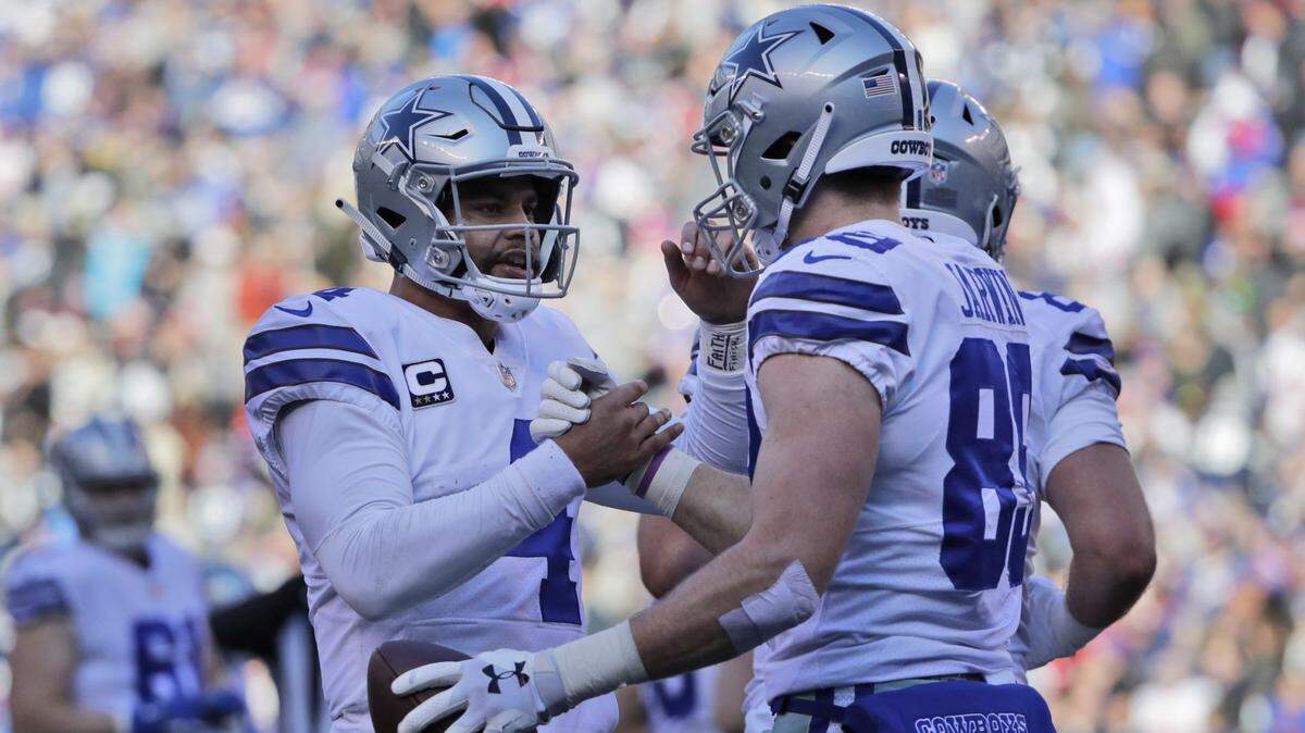 Dallas Cowboys quarterback Dak Prescott, left, and Blake Jarwin celebrate their touchdown during the first half of an NFL football game against the New York Giants, Sunday, Dec. 30, 2018, in East Rutherford, N.J. (AP Photo/Frank Franklin II)