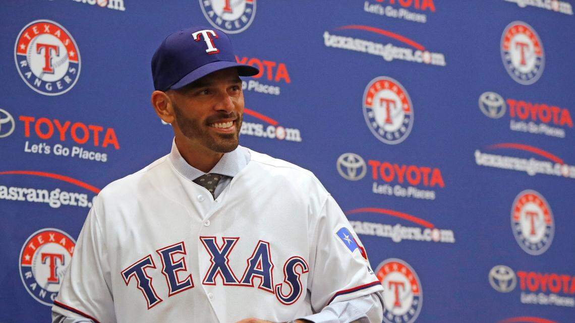 Texas Rangers newest manager Chris Woodward puts on his jersey at Globe Life Park in Arlington, Texas, Monday, Nov. 05, 2018. Woodward has been with the Los Angeles Dodgers for the last three seasons as the third base and infield coach. (Special to the Star-Telegram Bob Booth)