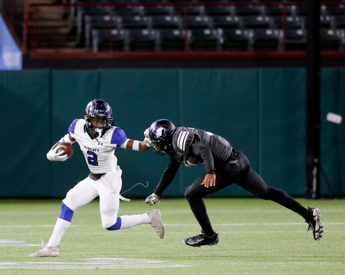 Byron Nelson cornerback Mike Jones (2) throws a stiff arm on the last play of a high school 6A Division 2 bi-district football playoff game at Globe Life Park in Arlington, Texas, Friday, Dec. 11, 2020. North Crowley defeated Byron Nelson 23-16. (Special to the Star-Telegram Bob Booth)