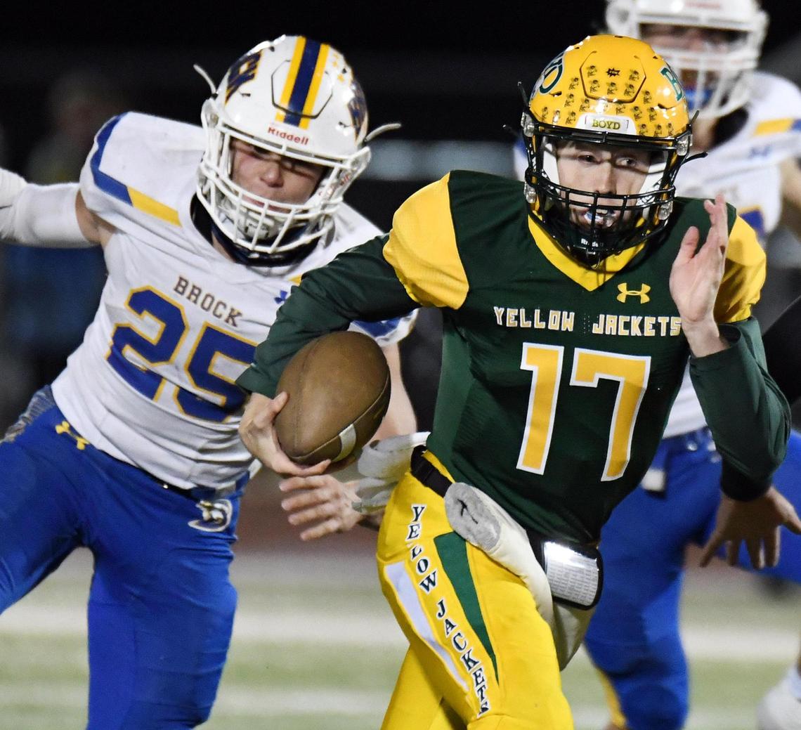 Boyd quarterbackk Zeb Souder, right scrambes out of the backfield as Brock’s Carson Carter gives chase in the fourth quarter of Brock’s 49-14 win in their District 4-3A football game Friday, October 23, 2020 at Yellowjacket Stadium in Boyd, Texas. Special/Bob Haynes
