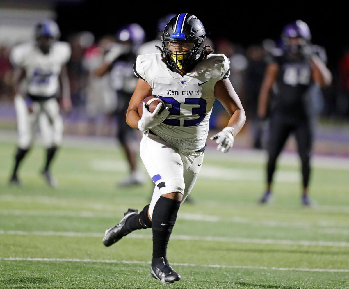 North Crowley halfback Madarrius Brooks (23) heads downfield for a touchdown during a high school football game at Eagle Stadium in Crowley, Texas, Friday, Aug 27, 2021. North Crowley defeated Crowley 33-7. (Special to the Star-Telegram Bob Booth)