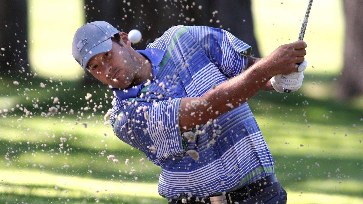 Dallas Cowboys quarterback Tony Romo hits out of the sand during a practice round at the 22nd American Century Celebrity Golf Championship at Edgewood Tahoe Golf Course.  Romo got a taste of some real golf when he made his debut on the PGA Tour in Thursday's  Corales Puntacana Resort & Club Championship in the Dominican Republic.