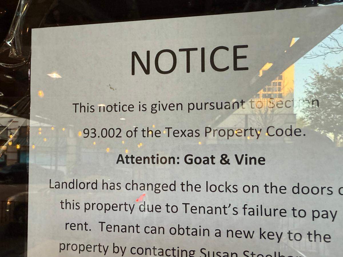 A sign on the door April 9, 2025, said Goat & Vine Restaurant & Winery in Fort Worth, Texas, was padlocked shut.